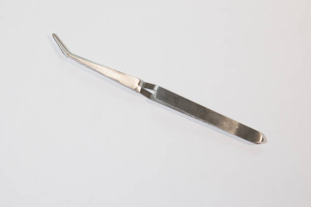 istock One tweezer on a white background. One tweezer closeup. 1222067835