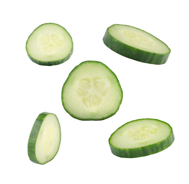 istock Falling Cucumber Slice Isolated on White Background, Close Up Vegetable in Air 1222069170