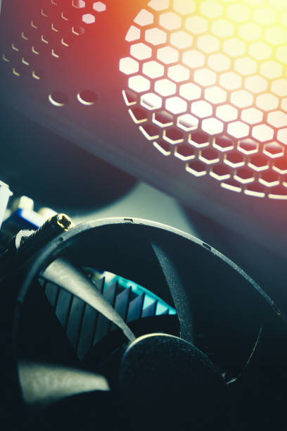istock A cooling system of PC. A fan of central processing or the CPU on motherboard cooler pc system unit. Lens glare and toned photo 1222070902