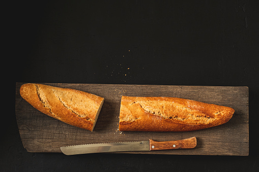 Crunchy french baguette and kitchen knife.