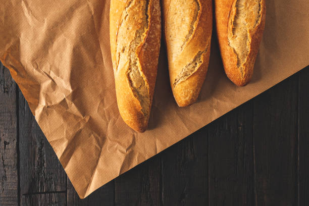 Wrapping crunchy french baguettes.