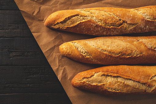 Wrapping crunchy french baguettes.