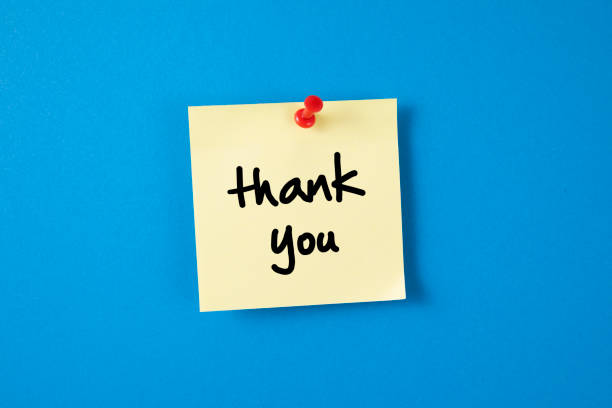 istock Yellow Adhesive Note Paper with Thank You Message on Blue background 1222072261