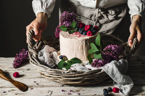 istock Chef presenting homemade fruit and flower cake 1222076048