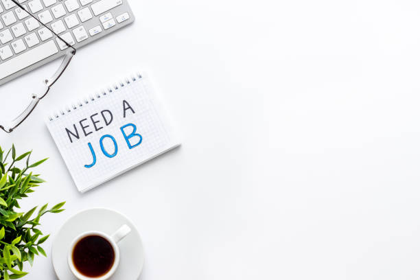 istock Need a job, looking for. Text on white office desk top-down space for text 1222076634