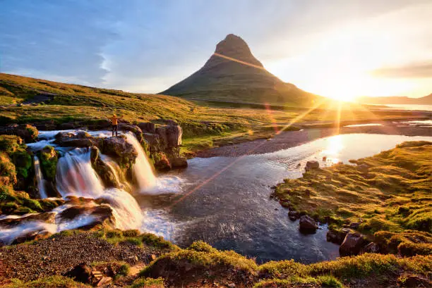 Photo of Beautiful landscape with sunrise on Kirkjufellsfoss waterfall and Kirkjufell mountain, Iceland.