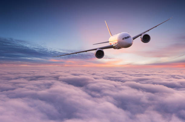 istock Commercial airplane jetliner flying above dramatic clouds. 1222078246