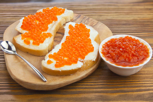 istock delicious appetizing sandwich with red caviar on  wooden 1222078337