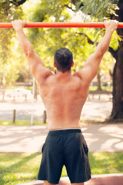 istock Young muscular man exercising outdoors 1222080861