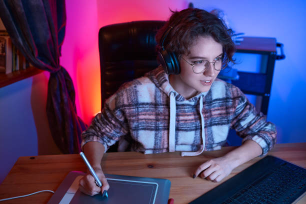 istock Digital desinger using graphic tablet and stylus. Freelancer desinger working from home 1222081135