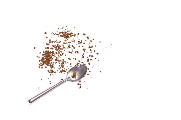 istock In selective focus a pile of instant coffee powder with a silver coffee spoon on white isolated background 1222082104