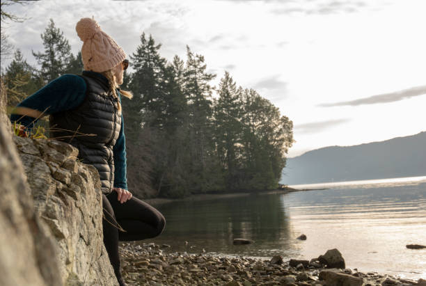 istock Woman relaxes on beach morning 1222082370