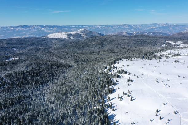 istock Aerial view of mountains covered in snow 1222082434