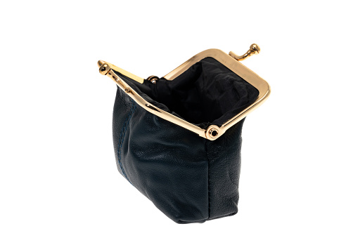 An empty ladies black leather change purse - white background