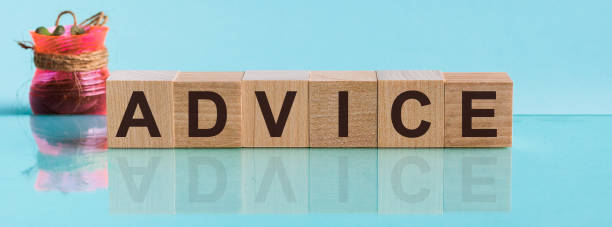istock ADVICE - word from wooden blocks with letters, to divide or use something with others share concept, blue background 1222084160