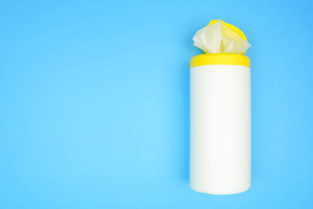 istock Container of alcohol sanitizing wipes, top view over a blue 1222084657