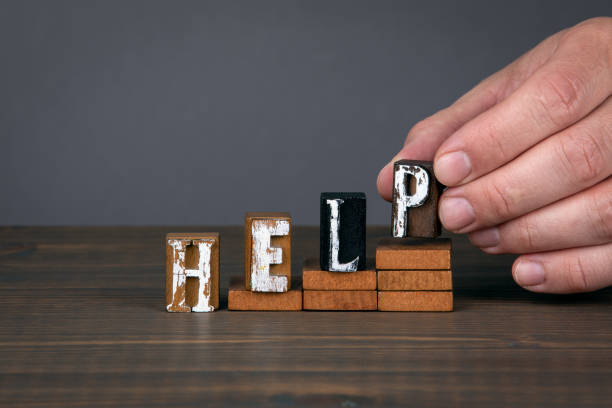 istock HELP. Support, stress and health concept. Wooden alphabet letters on steps 1222084721