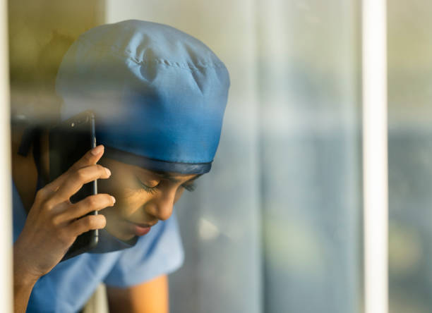 istock Tired Middle Eastern Doctor Taking a Break to Call a Loved One 1222085102