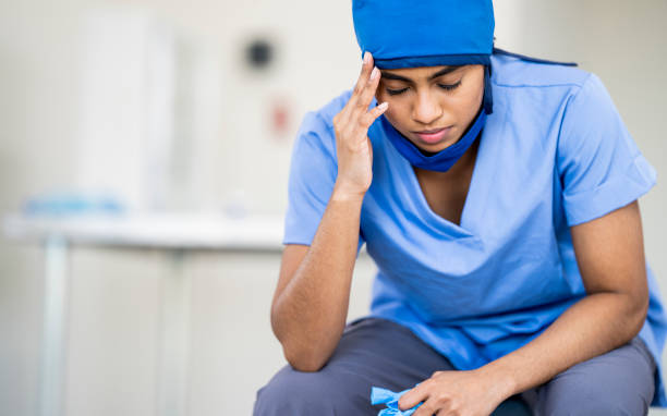 istock Female Middle Eastern Doctor Sits Down After a Long Shift 1222085112