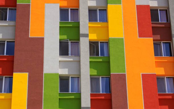 istock Colored building wall with apartment windows 1222086180
