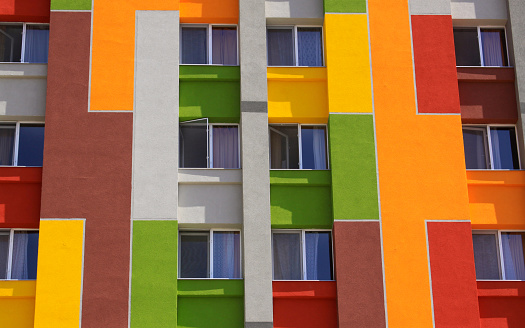 Colored building facade with apartment windows