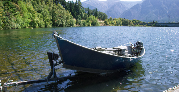 A Small Boat Sits on a Boat Trailer in the Columbia River in Washington on a Sunny Day