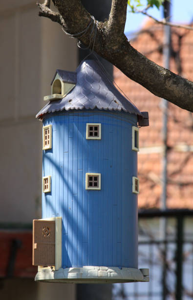 istock Blue birdhouse shaped like a miniature barn 1222086558