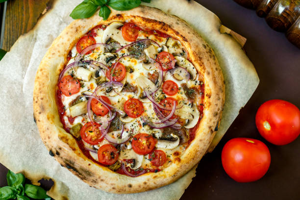 istock pizza with mozzarella cheese with tomatoes red onion and tenderloin 1222087872