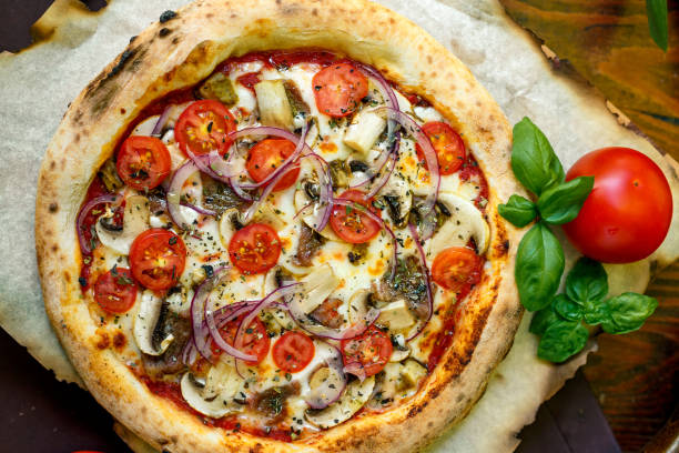 istock pizza with mozzarella cheese with tomatoes red onion and tenderloin 1222087898