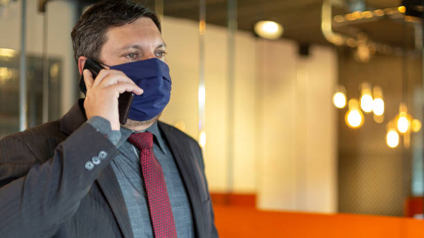 istock Businessman wearing face mask at office 1222088065
