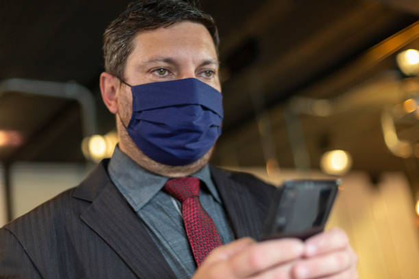 istock Businessman wearing face mask at office 1222088075