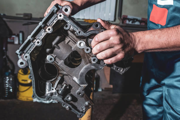 istock Hands auto mechanic, and engine parts close-up. 1222092274