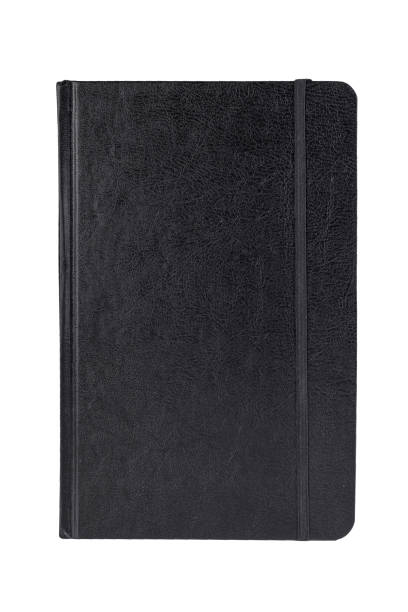 Black leather notebook isolated on white. Close-up. Black leather notebook isolated on white. Close-up. moleskin stock pictures, royalty-free photos & images