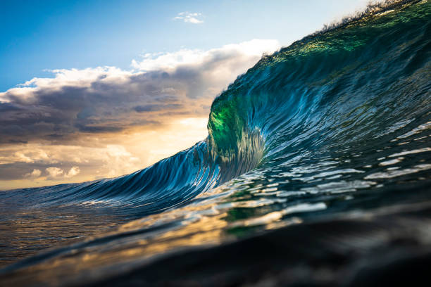 istock Colourful wave about to break in ocean at sunrise 1222094700