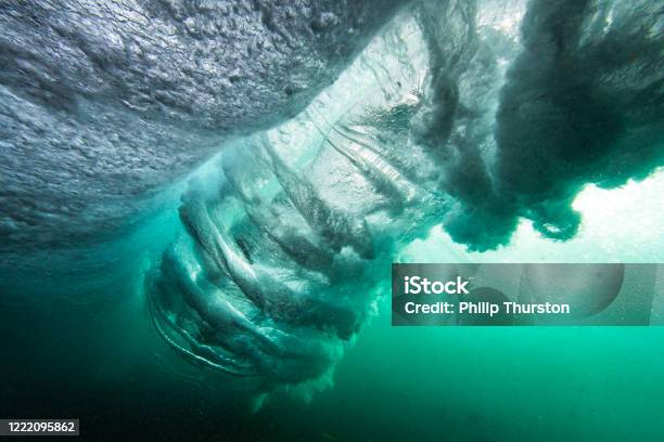 Wave Breaking From Underwater At Sunrise Stock Photo - Download Image Now - Wave - Water, Underwater, Tsunami