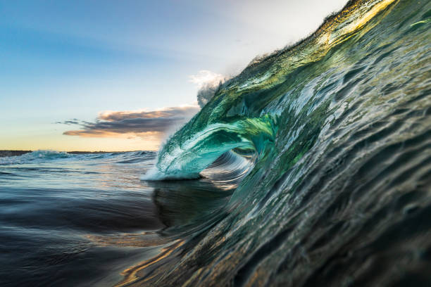istock Colourful wave breaking in ocean over reef and rock 1222095955