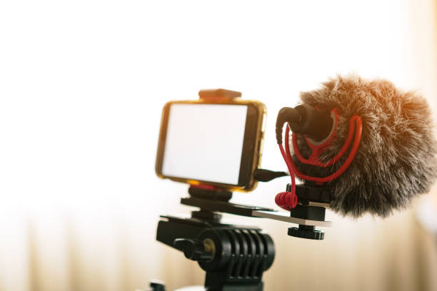 istock smartphones connected to an external microphone and coupled to a tripod. 1222096152