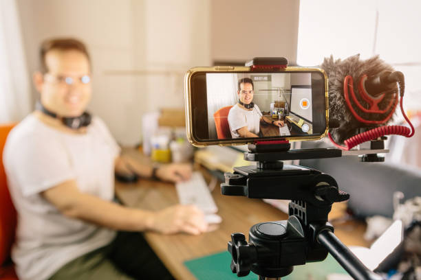 istock Boy recording content with his mobile phone for online courses or online training. Use an external microphone to make it easier to hear. At home 1222096154