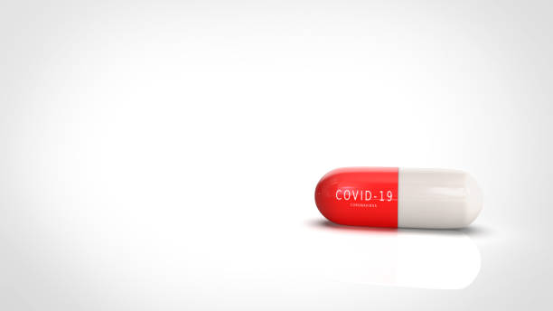 istock Covid-19 vaccine capsule red-white color include text on the red capsule with 3d rendering. 1222097584