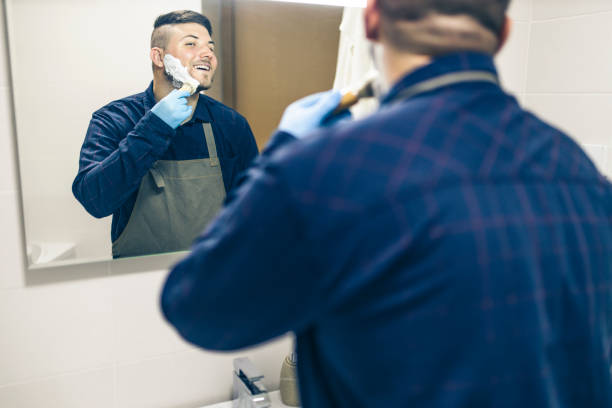 istock Man shaving with electric razor 1222098563