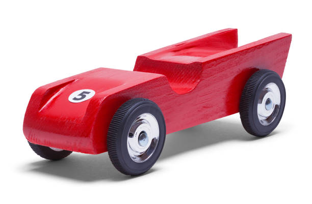 Pinewood Derby Car Red Wood Derby Car Isolated on White. wooden car stock pictures, royalty-free photos & images