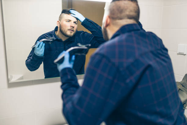 istock Man making haircut at home during quarantine 1222101161