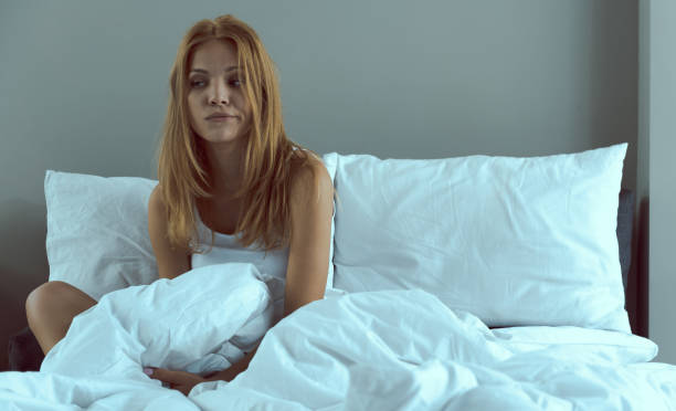 istock Sad girl not enjoying early waking up 1222102440