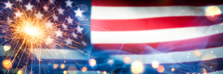 Sparkler With Bokeh And Smoke On American Flag Background - Independence Day Celebration Concept