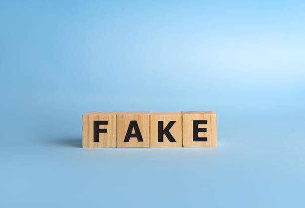 istock FAKE word with building blocks on a blue background 1222106261