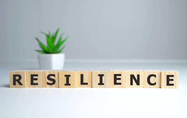 Resilience word concept on cubes on white background.