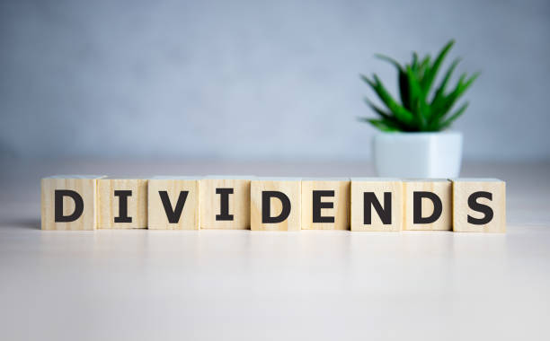 istock Text DIVIDENDS on cube dice with background, finance concept 1222106290