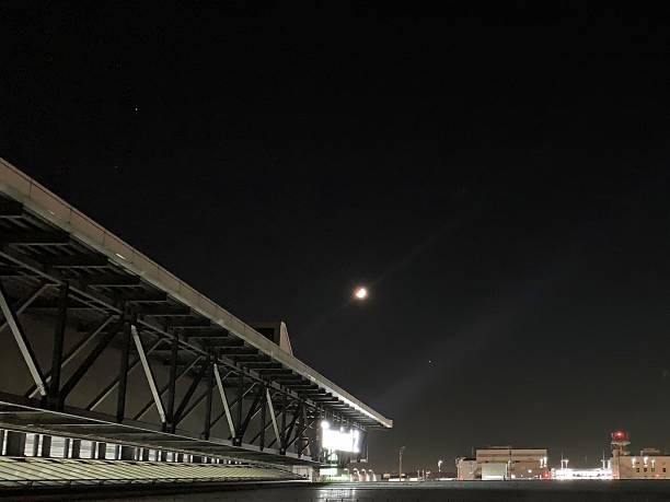 Narita Air Port Terminal 2 (Tokyo) - October 04, 2019\nNight view seen from the north wing of Terminal 2.\nThere was a half moon on the roof.