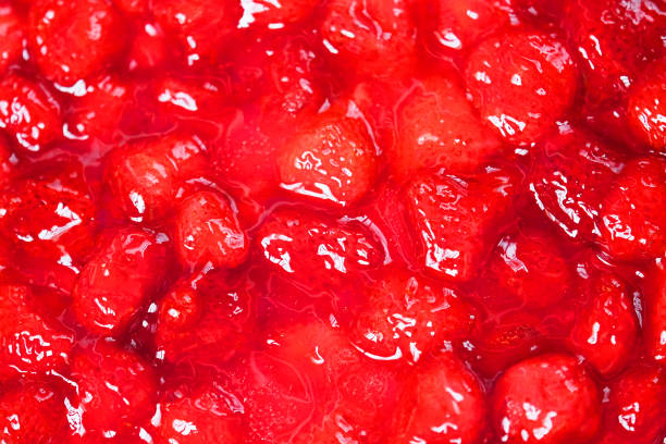 istock Strawberry pie, macro. Red sweet strawberry jam background texture. Top view, surface glare 1222107698