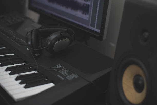 istock Professional monitors, headphones, midid keyboard and pc with music software. 1222107770